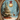 A richly detailed digital painting depicting a magical Christmas scene enclosed within an elaborate, gold, oval frame. A snow-covered evergreen tree, adorned with red ornaments and lit candles, stands beside a brown deer in a snowy forest, with numerous wrapped gifts at its base. A large, glowing gold and white ornament hangs from a red ribbon in the upper right, complementing the cool blue and white winter landscape with warm reds and golds, evoking a serene and festive holiday atmosphere.