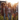 A group of four young adults are walking on a grassy field towards a stage. They are all smiling and appear happy, dressed in casual clothing; jeans, shorts, and plaid shirts. The stage is illuminated with bright lights, indicating a possible concert. The golden hour lighting adds a warm and inviting atmosphere.
