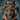 A close-up, eye-level portrait of a black and tan dachshund dog dressed in a whimsical Halloween costume. The dog wears large, round orange-framed glasses, a black glitter crown with the word 'BOO' in orange letters, and a black cape with an orange collar and bow. The background is a blurred, textured dark blue.