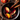 An overhead shot shows a silver pot on a dark wooden surface, filled with dark red mulled wine. Floating in the wine are two red and yellow apple slices, one vibrant orange slice, several brown cinnamon sticks, and dark brown star anise. Small bubbles are visible on the surface of the simmering drink, creating a warm, inviting, and rustic festive scene.