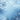 A vertical abstract background image featuring a frame of frosty, stylized tree branches against a gradient blue sky. The branches, appearing white with light blue highlights in the foreground and fading to darker blue silhouettes in the background, create a soft, ethereal border around a luminous light blue center. This design evokes a serene winter or holiday atmosphere suitable for various visual content.