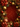A vibrant, festive Christmas background featuring a rich red damask-patterned center. It is framed by opulent gold and red holiday decorations, including glossy red and gold baubles, glittering gold beads and foliage, dark green pine needles, and striking red poinsettia flowers with gold centers, creating a luxurious and traditional holiday atmosphere.