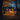 A two-story house is shown at dusk, decorated for Halloween. Pumpkins line the walkway and front lawn. Warm light shines from the windows, and autumn-colored leaves adorn the trees surrounding the house, creating a cozy and festive atmosphere.