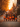 A group of seven children dressed in Halloween costumes stand in a line on a residential street at sunset. The children, ranging in age from approximately 5 to 10 years old, are dressed as a mix of characters including a princess, animals, a witch, and a skeleton. Each child holds an orange, pumpkin-shaped bucket, and golden sunlight filters through the trees in the background, creating a warm and inviting atmosphere.