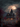 A large, three-story Victorian mansion is centered under a full, bright moon in a nighttime scene. The house is surrounded by a graveyard with various weathered tombstones and autumn-colored trees. Bats are flying in the sky above the house, creating a spooky and mysterious atmosphere.