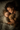 An overhead shot shows a mother and young son sleeping side-by-side in bed. The child is holding a brown teddy bear, and the mother has her eyes closed, resting her head near the child's. They are both covered in a white duvet. The scene evokes feelings of love, safety, and peacefulness.