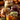 Four glass jars filled with Thanksgiving dinner ingredients are arranged on a weathered wooden table. The jars showcase colorful layers of food, including turkey, stuffing, mashed potatoes, and cranberry sauce. Autumnal elements like fallen leaves and small pumpkins provide a warm and inviting holiday backdrop.