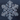 A stunning, highly detailed macro photograph of a single, perfectly formed snowflake centered against a dark, muted bluish-gray background. The transparent ice crystal exhibits intricate hexagonal symmetry with branching arms, sharp facets, and subtle internal refractions, highlighting its delicate natural beauty and complex structure.