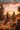 Two women are mountain biking up a grassy hillside trail. They are wearing helmets and cycling gear. The background is a vibrant sunset with orange, pink, and blue clouds. Mountains can be seen in the distance, silhouetted against the sky. The overall scene evokes a sense of adventure and freedom.