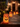 A row of illuminated paper bag luminaries lines a stone walkway leading to a house at night. Each paper bag has a jack-o'-lantern face cut into it and emits a warm orange glow. The house in the background is softly illuminated, creating a festive and welcoming Halloween scene.