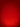 A vibrant red abstract background featuring a subtle gradient from deep red to a brighter red at the bottom. The lower half is filled with numerous sparkling, out-of-focus light specks resembling glitter or bokeh, creating a luminous and festive effect that fades upwards.