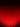 An abstract background image featuring a vertical color gradient transitioning from solid black at the top to a rich, vibrant red at the bottom. The red area is heavily textured with small, scattered black and red speckles, resembling fine dust, glitter, or sparks. The density of these particles increases significantly towards the bottom edge, creating a visually dynamic and textured effect.