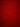 A vertical image featuring a seamless, repeating pattern of various Christmas and winter holiday motifs on a rich, deep red background. The detailed elements, including snowflakes, Christmas trees, Santa hats, and gift boxes, appear embossed with subtle shadows and highlights, creating a luxurious textured effect. The uniform red color with its subtle gradient contributes to a warm and festive atmosphere, ideal for seasonal themes.