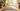 Professional sunny minimalist living room with jute rug and plants - high-quality image for marketing and content creation