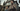 Professional concerned couple standing in front of their home - high-quality image for marketing and content creation