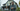 Professional concerned couple looking up at old house - high-quality image for marketing and content creation