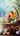 A close-up vertical shot of a rustic woven wicker basket filled with green moss. Inside the moss are three miniature houses, one white and two yellow, accompanied by two decorated Easter eggs in green and blue. On the dark wooden surface in front of the basket are two more decorated Easter eggs (blue and purple) and delicate white and gold ribbon bows, set against a soft, blurry blue and green background with faint tree branches.