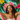 A young woman with dark skin and dreadlocks is centered, her eyes closed and a gentle smile on her face, embodying relaxation. She wears a wide-brimmed hat with a vibrant, multi-colored pattern and a light pink bandeau top, partially visible as she rests in a pink and cream striped hammock. The background is a bright teal-blue, decorated with large green monstera leaves and artificial-looking yellow and hot pink plumeria flowers.