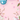 A visually appealing vertical image showcasing a pastel pink background adorned with spring flowers and decorated Easter eggs. Three eggs, two in teal with white floral patterns and one white with pink flowers, are nestled among pink cherry blossoms, white magnolia-like flowers, and pussy willow branches. The arrangement creates a decorative border with a clear central space, complemented by scattered light pink petals, conveying a fresh and joyful spring mood.