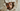 Professional wide-eyed man peering through damaged wall hole - high-quality image for marketing and content creation