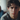 Professional concerned teenage boy portrait with blurred family background - high-quality image for marketing and content creation